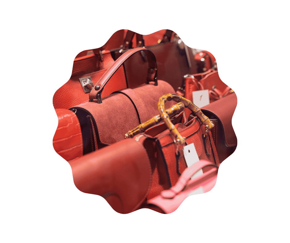 multiple handbags arranged on a rack