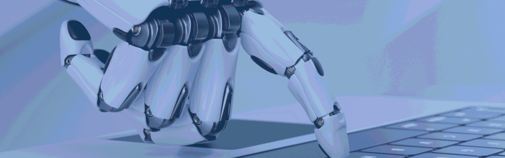 Close-up of a white and black robotic hand with articulated metal joints pressing a key on a laptop keyboard
