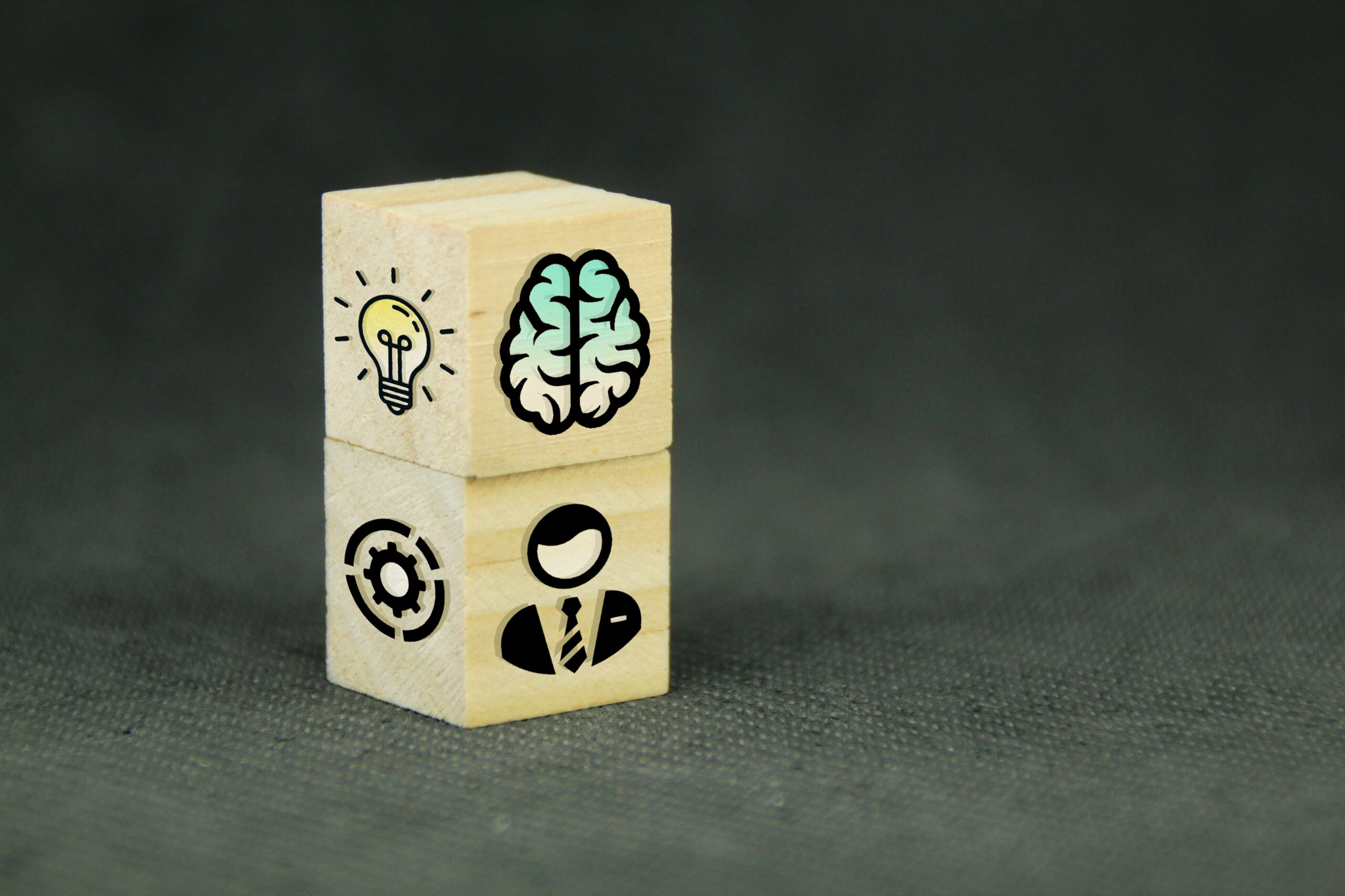 wooden-blocks-illustrating-business-skills-on-gray