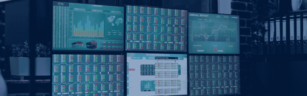 Multi-monitor business operations dashboard displaying analytics, reports, and real-time data insights