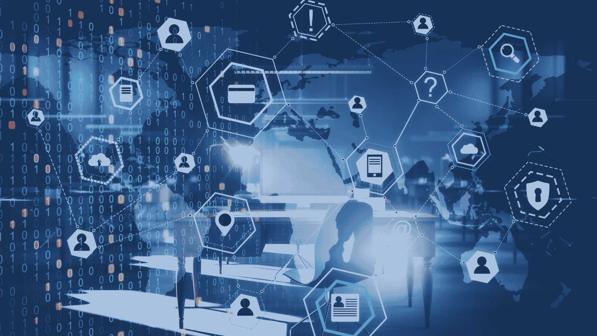 person at desk surrounded by data icons representing cybersecurity, cloud computing, and global network connections