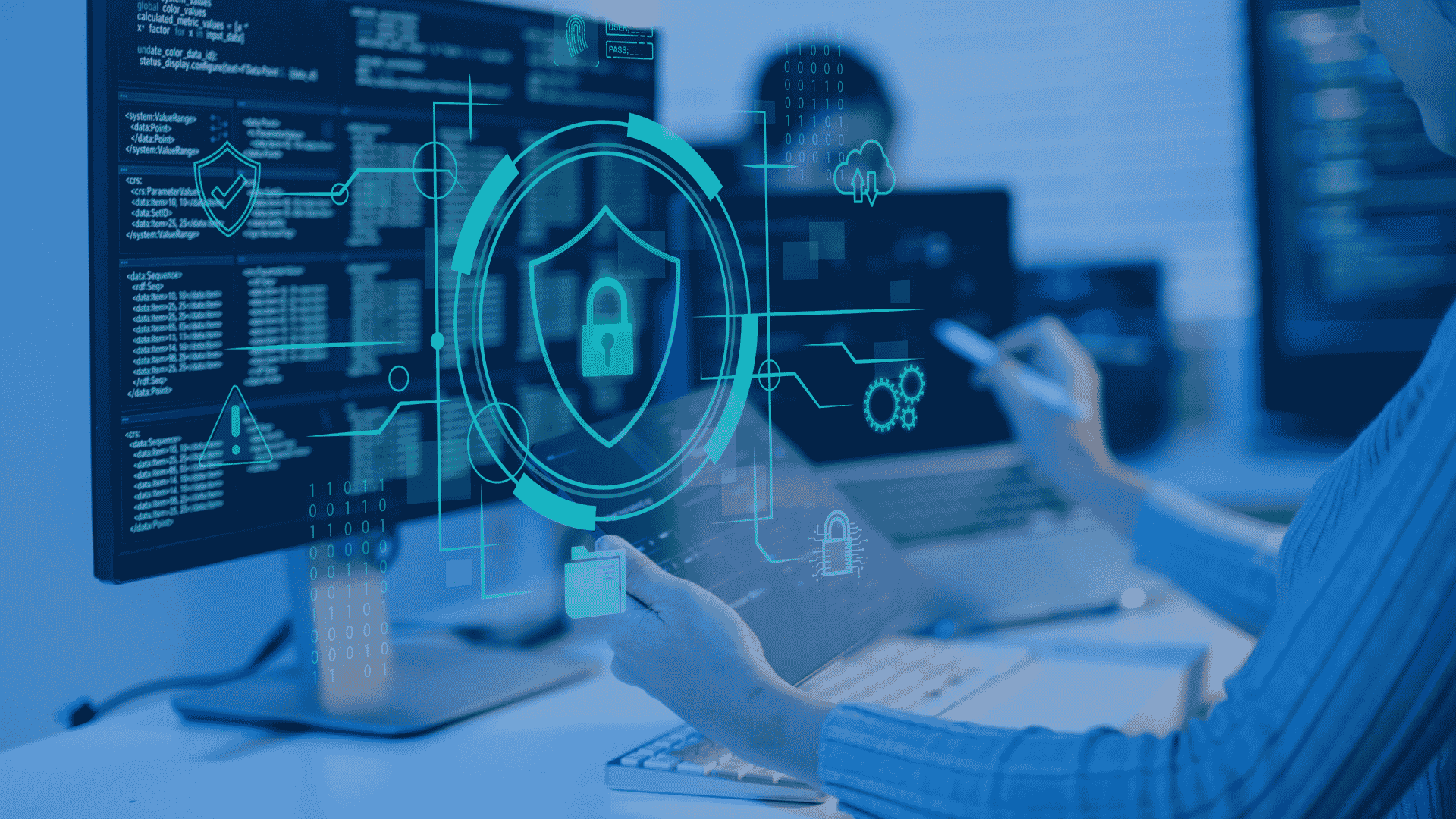 Cybersecurity professional analyzing security dashboards and system data on multiple screens with digital shield, lock, and network protection graphics.